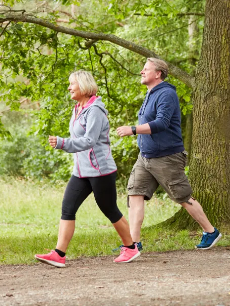 Person walking outdoors, recovered mobility